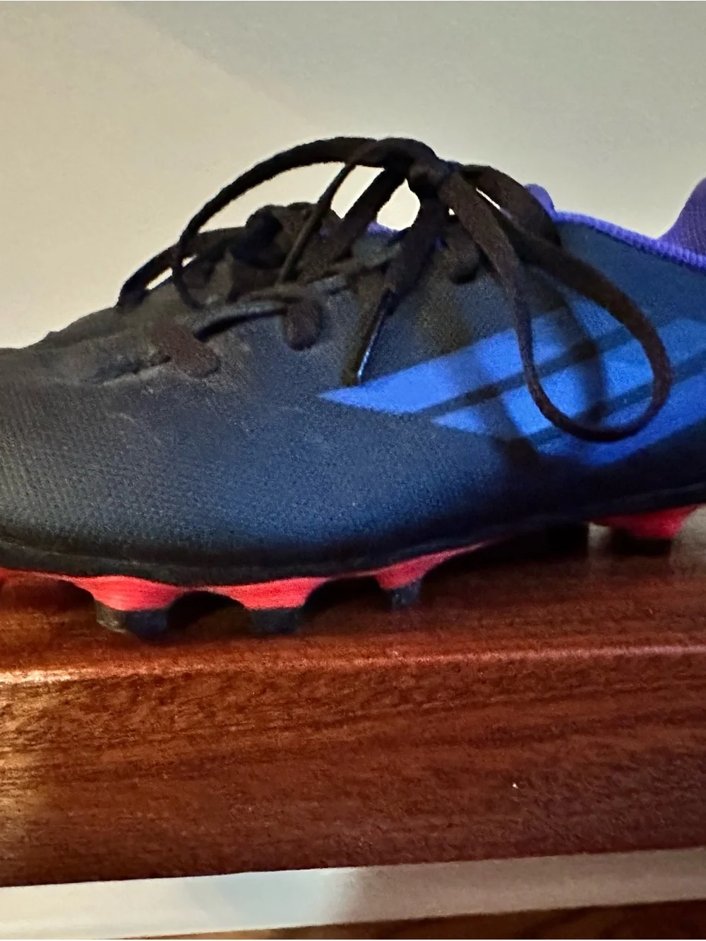 adidas Black Cleats with Blue Accents and Red Studs